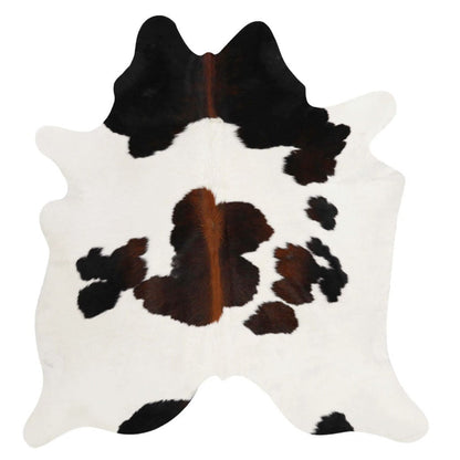 Chocolate and white cowhide rug