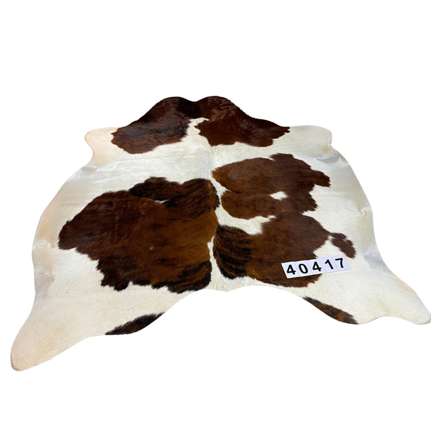 Chocolate and white cowhide rug