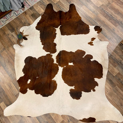 Chocolate and white cowhide rug